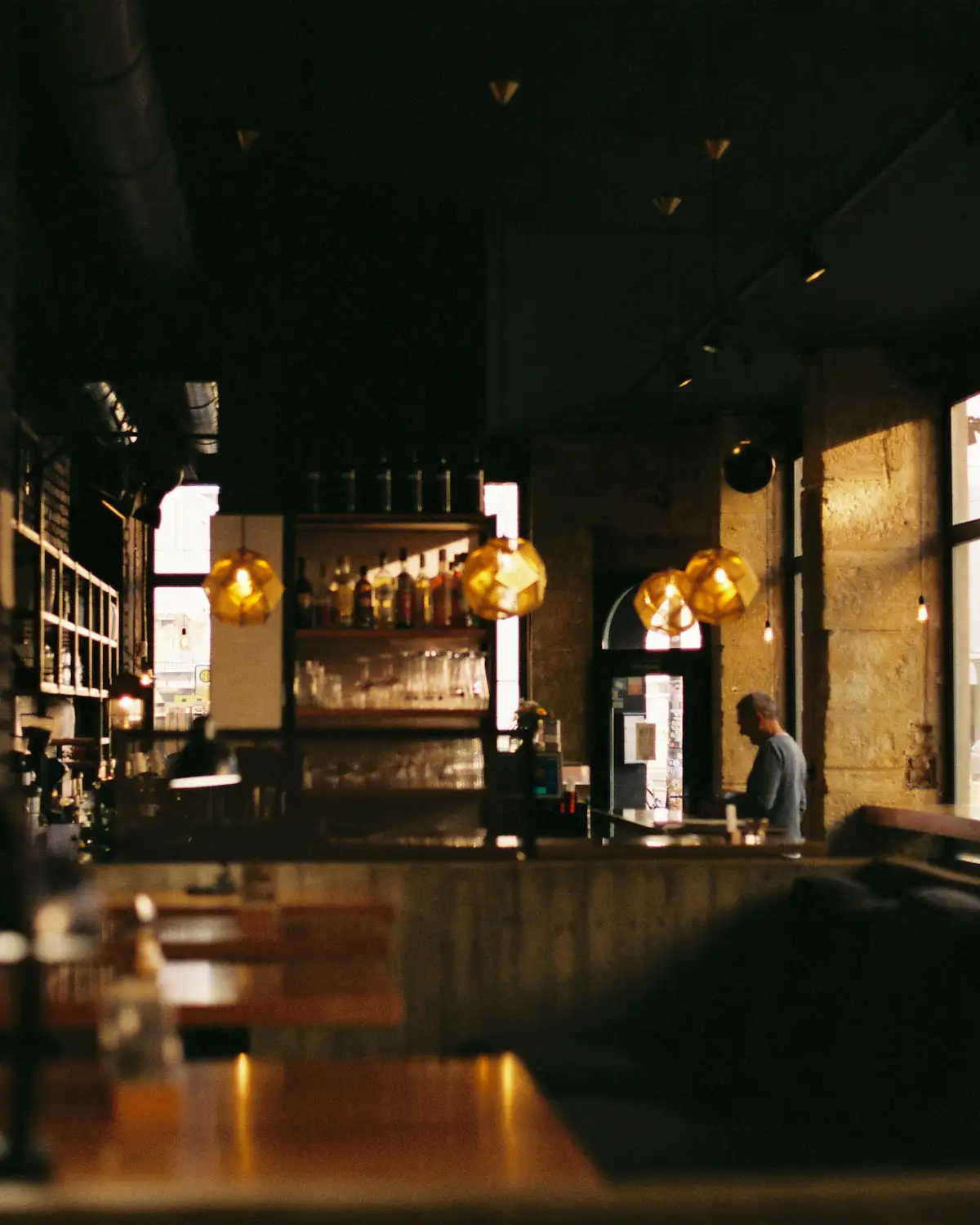 Placeholder: a dimly lit restaurant interior, standing in for banquette panels made with the Monolit Method.